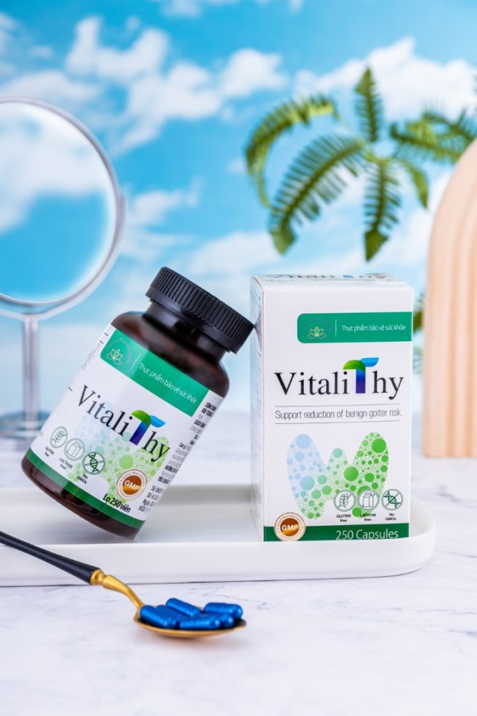 VitaliThy is a new Natural Desiccated Thyroid supplement from Vietnam.  Capsules are placed on a golden spoon in front of VitaliThy cardboard box and bottle. 